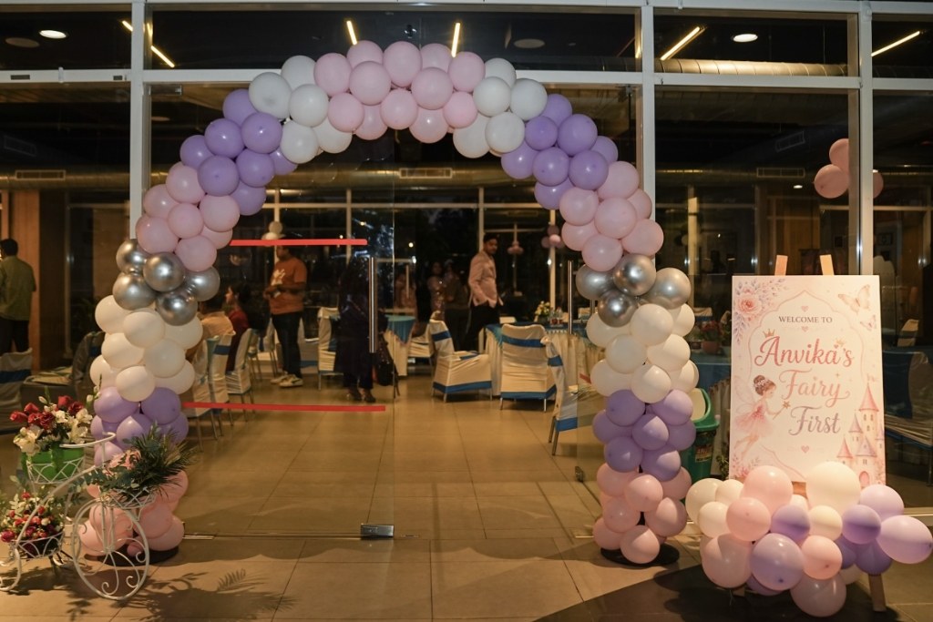 Grand pastel pink, lavender and chrome balloon arch entrance